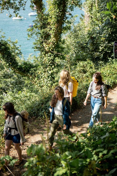 files/group-walking-woods-to-beach-blue-sea.jpg